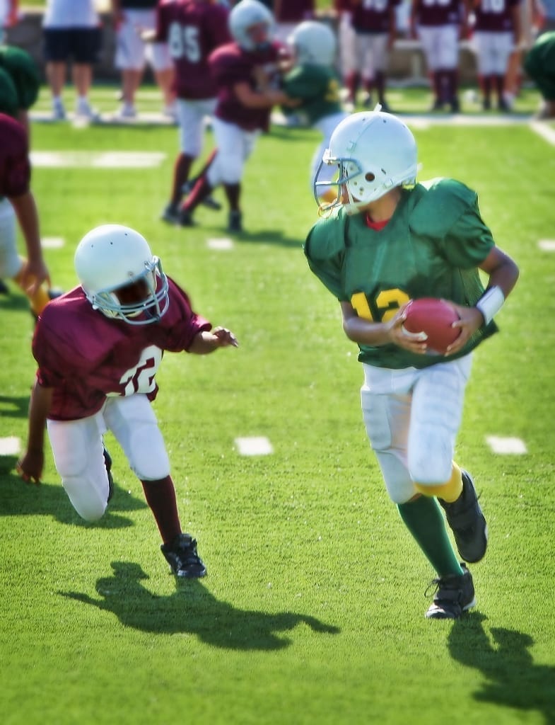 Children playing youth football