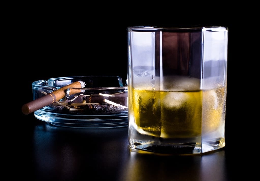 Image of a cigar and alcoholic beverage