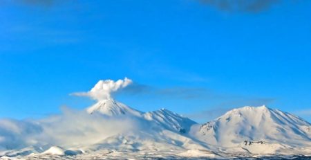 Volcano erupting in the distance