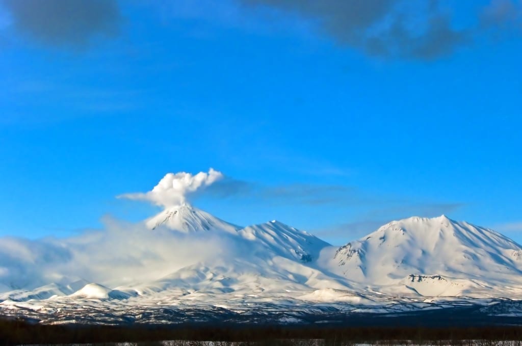 Volcano erupting in the distance