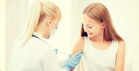 You girl receiving a vaccine
