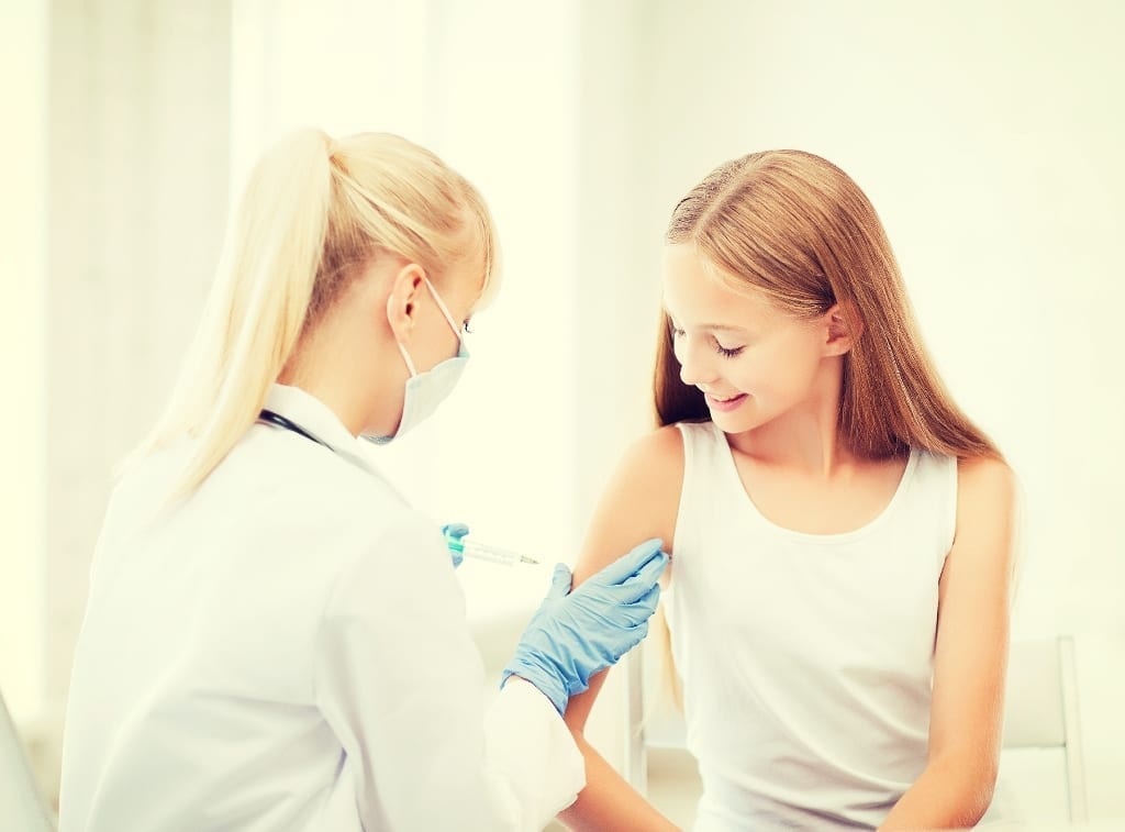 You girl receiving a vaccine