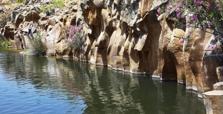 Basalt Rock Surrounding a Reservoir. 